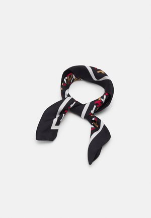 Black silk neck scarf with white border and multicolored abstract geometric pattern, loosely looped on a plain background.