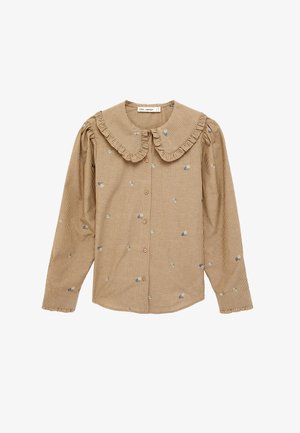 Blouse beige à manches longues avec fines rayures verticales, petits imprimés floraux, col large à volants, boutonnage devant et poignets à volants.