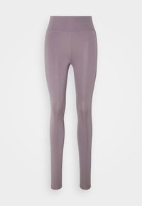 Leggings taille haute violet clair en tissu extensible, avec une texture lisse et un design ajusté qui se rétrécit aux chevilles.