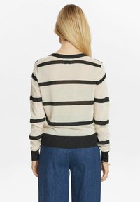 Beige striped sweater with black horizontal stripes, ribbed cuffs, and hem. Lightweight knit with a relaxed fit. Back view.