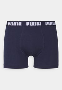 Navy blue cotton boxer shorts with white Puma logo on waistband, features a snug fit and a smooth texture, with a supportive front pouch.