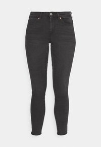Zwarte skinny jeans van denim, met een hoge tailleband, centrale rits en koperen knop en klinknagels. Glad textuur, geen patronen.