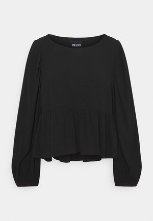 Blusa nera con scollo rotondo, maniche lunghe a sbuffo e orlo a peplo, realizzata in tessuto strutturato, con leggere arricciature sulle spalle.