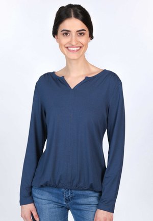 Marineblaues Langarmoberteil mit V-Ausschnitt, das mit gerafften Schultern und einem gerafften Saum versehen ist, aus weichem, dehnbarem Stoff.