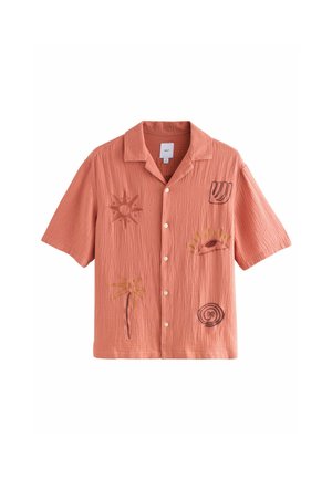 Short-sleeve, button-up shirt in coral with a textured finish, featuring sun, palm tree, and spiral motifs in brown and yellow embroidery.