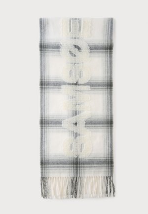 Écharpe à carreaux blancs et gris avec extrémités effilochées et texte blanc en relief lisant "ACNE STUDIOS" verticalement au centre.
