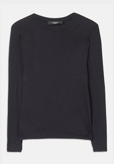 Black long-sleeve shirt with a round neckline, made from soft fabric. Features a simple design and subtle stitching details along the hem.