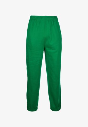 Rohelised dressipüksid elastse vöökoha, kitsenevate jalgade ja sujuva tekstuuriga. Ilma nähtavate taskute või mustriteta.