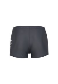 Shorts de bain pour hommes en gris foncé, fabriqués en tissu doux et extensible. Présente un design épuré avec un minimum de branding en blanc sur le côté.