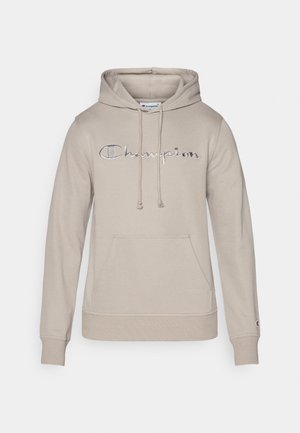 Beige hoodie made of fleece with a front pouch pocket. Features a drawstring hood and embroidered "Champion" logo in silver.