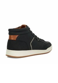 Black high-top sneaker with suede material, leather accent at the heel, rubber sole, and gray stitching details. Designed with a perforated collar.