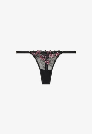 String noir transparent avec motif papillon floral rose brodé et fines bretelles latérales réglables.