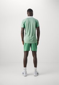 adidas Performance TENNIS ERGO - Short de sport - preloved green