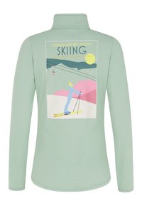Miętowa bluzka z długim rękawem z grafiką narciarską z tyłu, z żółtymi i różowymi akcentami oraz zamkiem błyskawicznym w kołnierzyku.