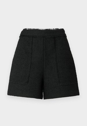 Black shorts made of textured fabric with a frayed hem, featuring two front pockets and a tailored fit.