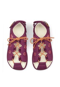 Purple sandals with a mixed material design, featuring mesh panels, hexagonal cutouts, orange laces, and a Velcro strap on the heel.