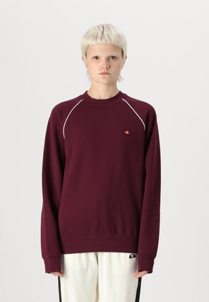 Bordeaux sweatshirt med lange ærmer, ribbet hals og hvide piping-detaljer. Lille logolap på den øverste venstre bryst. Blød stoftekstur.