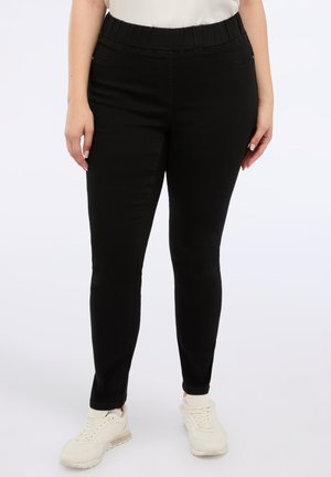 Schwarze Denim-Jeggings mit elastischem Bund, slim fit und Vordertaschen. Das Material hat eine glatte Textur und eignet sich gut für die Freizeit.
