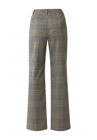 Wide-leg trousers in a houndstooth pattern featuring black, white, and orange accents. Made of woven fabric with a smooth texture.