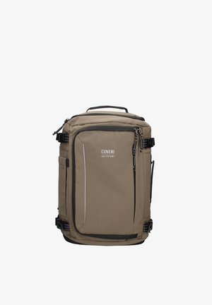Zaino rettangolare beige con tasca frontale con cerniera, spallacci e fibbie nere, maniglia superiore e logo "COVERI active" sul pannello frontale.
