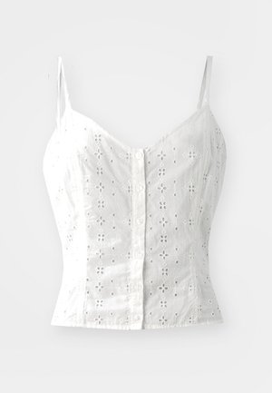 Weiße ärmellose Bluse mit floralem Lochmuster, vorderem Knopfverschluss und figurbetontem Schnitt. Weicher Stoff mit zarter Textur und dünnen Trägern.