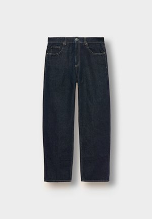 Dark blue denim jeans with a loose fit, five pockets, and contrast stitching. Features a button and zipper closure. Smooth texture.