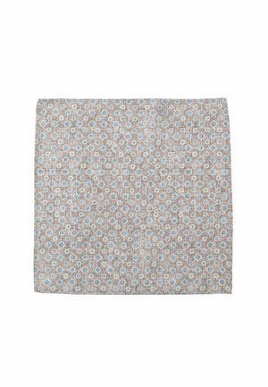 Textile placemat with a light brown base, featuring a repeating pattern of small blue and white circular designs. Soft texture and rectangular shape.
