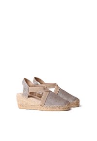 Wedge sandals with a woven beige fabric upper, elastic straps, and a jute-wrapped heel. Features a rounded toe and textured finish.