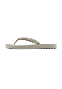 Beige flip-flops with a textured sole, featuring a sparkly, rhinestone-embellished strap and a smooth footbed.