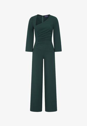 Donkergroene, lange mouwen jumpsuit met brede pijpen, asymmetrisch gerimpeld lijfje en ritssluiting aan de achterkant.