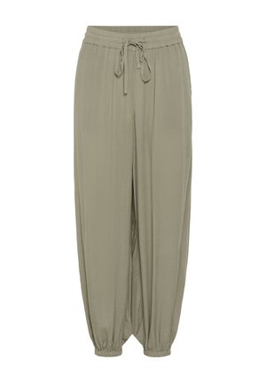 Pantalon ample de couleur vert olive avec taille élastique, cordon de serrage et poignets élastiques froncés aux chevilles.