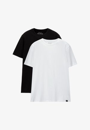 Two regular fit t-shirts, one black and one white, made from cotton. Each has a crew neck and short sleeves. Simple design, no patterns.