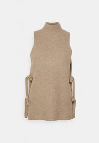 Veste sans manches beige en tricot avec col montant et liens sur les côtés, présentée sur un fond blanc uni.