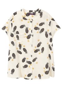 Blouse à manches courtes, tissu crème avec motif ananas noir et étoile jaune, boutonnée à l'avant, détail poche côté gauche.