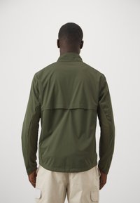 Patagonia WIND SHIELD JACKET - Soft shell jacket - pine needle green