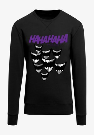 Czarna bluza z grafiką przedstawiającą napis "HAHAHA" w kolorze fioletowym oraz liczne stylizowane białe zęby i kontury twarzy.