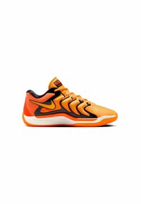 Orange athletic shoe with black accents, textured upper, and rubber sole. Features a padded collar and distinctive swoosh logo design.