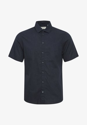 Camisa de manga corta en tejido azul marino oscuro, con cierre de botones en la parte delantera, cuello y un pequeño detalle del logo en el lado izquierdo del pecho.