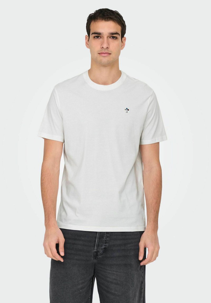 White cotton t-shirt with a round neckline and short sleeves, featuring a small multicolored logo on the left chest.