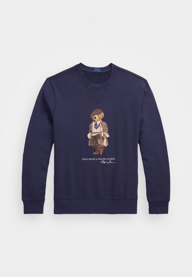 Sweatshirt en coton bleu marine mettant en avant un graphique d'ours vêtu d'une tenue tailleur, avec des poignets et un col côtelés. Texte "Polo Bear by Ralph Lauren" inclus.