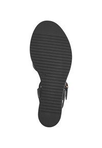 Black sandal sole featuring a textured surface with horizontal grooves and a rounded shape, designed for grip and stability.