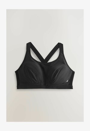 Must spordirinnahoidja vormitud tasside, laiade ristpitsade ja sileda kangaga. Omaduseks on pehme logo ja allosas elastne riba.