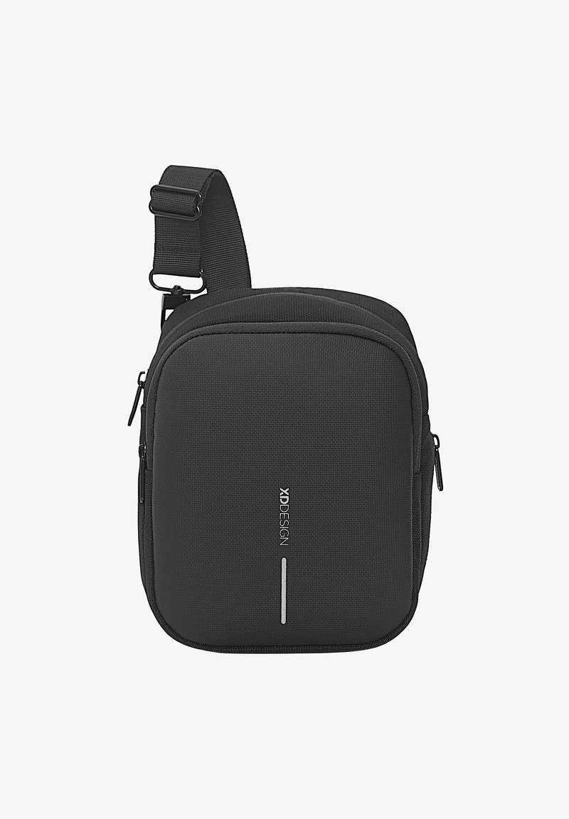 Black shoulder bag made of textured fabric, featuring dual zippers, adjustable strap, and a logo accent on the front.