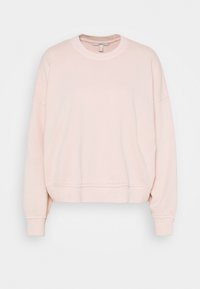 Ljusrosa sweatshirt i mjukt tyg, med rund halsringning, sänkt axelsöm och ribbad nederkant med en avslappnad passform.