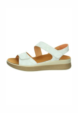 White open-toe sandal with two adjustable straps, cushioned tan insole, and a beige sole with slight wedge heel.