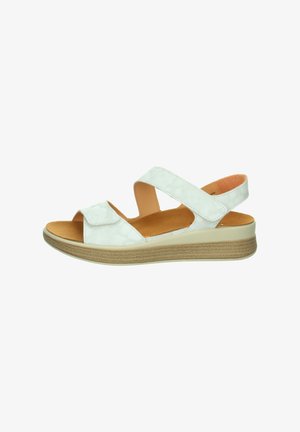 White open-toe sandal with two adjustable straps, cushioned tan insole, and a beige sole with slight wedge heel.