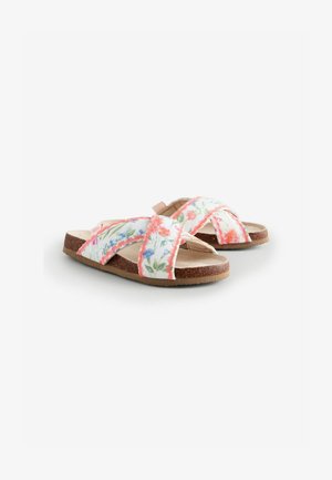 Sandale slide cu model floral, cu bretele încrucișate, în culori pastelate, având o talpă texturată maro și detalii cu marginile ondulate roz.