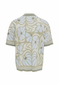 Pull en maille à manches courtes avec fond beige et motif floral bleu clair, comportant un petit col et un bord zigzag aux manches et à l'ourlet.