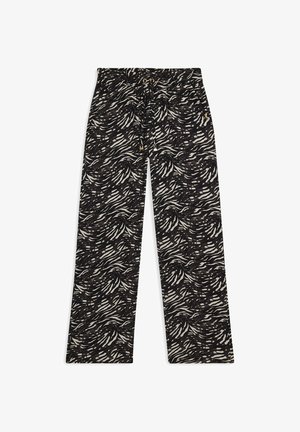 Pantalones estampados en blanco y negro con un diseño ondulado, cinturilla elástica, cordón ajustable y piernas rectas de corte holgado.