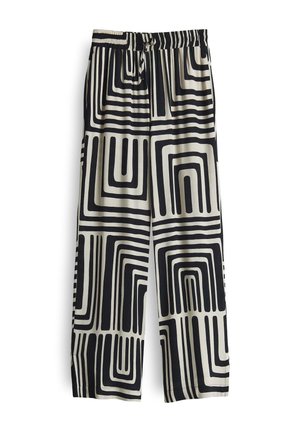Pantaloni ampia a righe nere e crema con un motivo geometrico di linee spesse e curve. Vita elastica con cordoncino per una vestibilità regolabile.